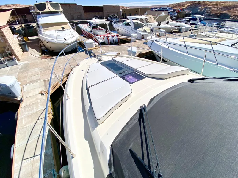 Slide: The Image of 2015 Monte Carlo MC5S yacht docked among other boats in a marina. - 49