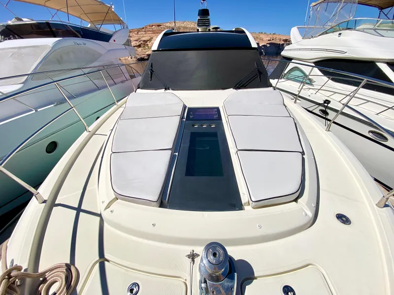 Slide: The Image of 2015 Monte Carlo MC5S yacht with sunbathing deck, docked between other boats. - 50