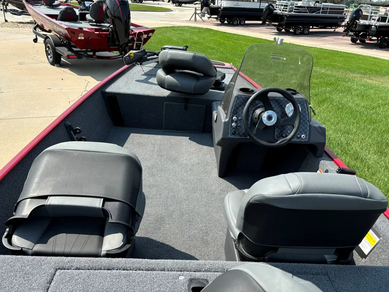 Slide: The Image of 2024 Tracker Bass Tracker Classic XL fishing boat interior with steering console and seating. - 3