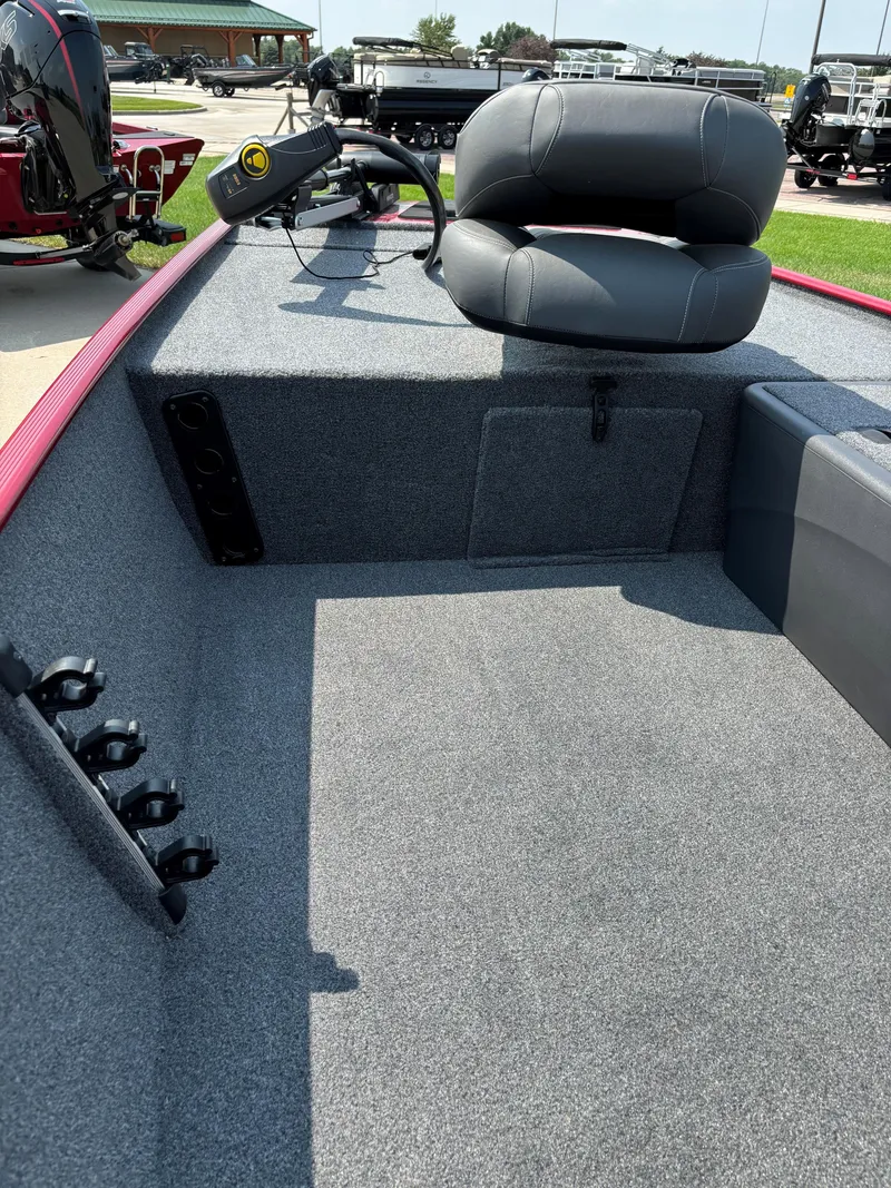 Slide: The Image of 2024 Tracker Bass Tracker Classic XL boat interior with seating and fishing rod holders. - 4