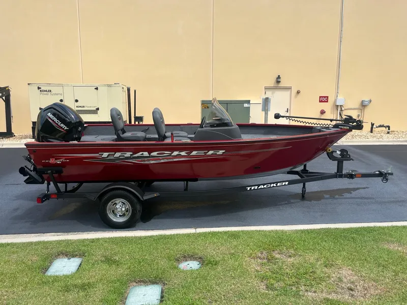 Slide: The Image of 2024 Tracker Pro Guide V-16 SC fishing boat on trailer. - 2