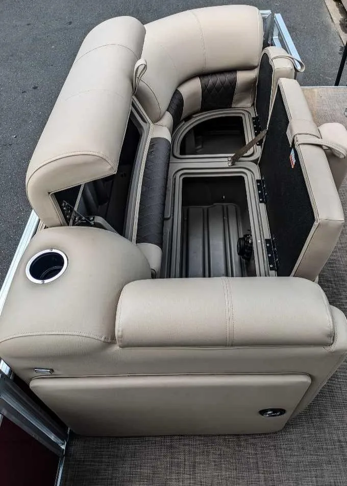 Slide: The Image of 2024 Sun Tracker Party Barge 20 DLX interior seating and storage compartments. - 10