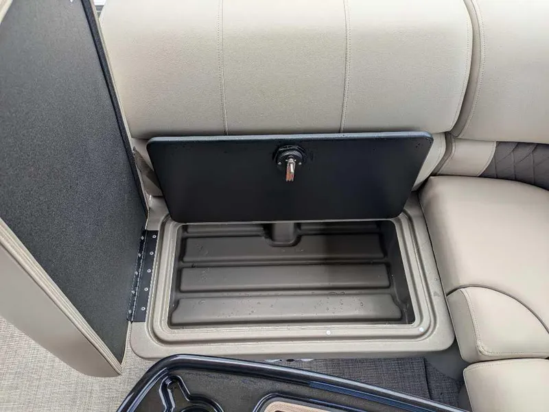 Slide: The Image of 2024 Sun Tracker Party Barge 20 DLX storage compartment under seat. - 11