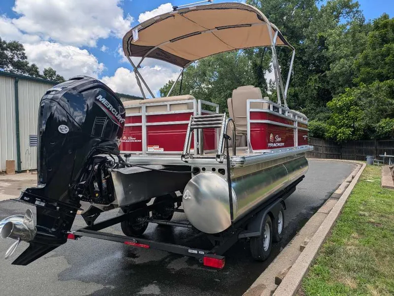 Slide: The Image of 2024 Sun Tracker Party Barge 20 DLX pontoon boat with Mercury outboard engine. - 15