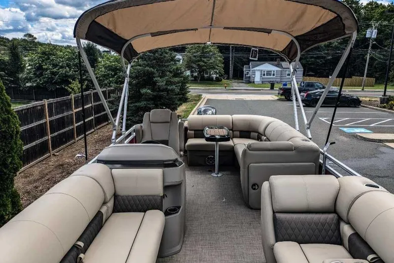 Slide: The Image of 2024 Sun Tracker Party Barge 20 DLX pontoon boat with spacious seating and canopy. - 3