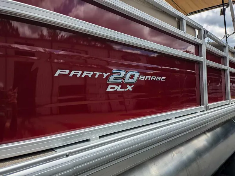 Slide: The Image of 2024 Sun Tracker Party Barge 20 DLX pontoon boat, close-up of model name. - 4