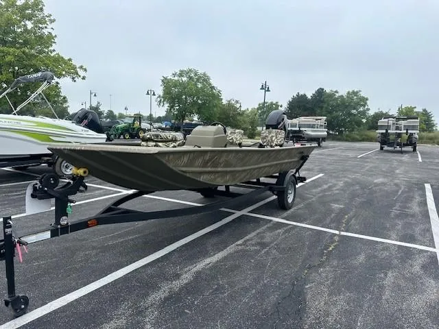 The Image of 2024 Tracker Grizzly 1754 SC boat on trailer in parking lot. - 0