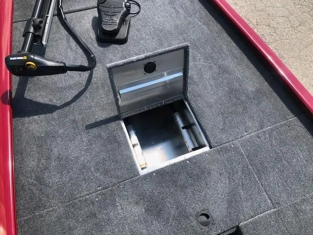 Slide: The Image of 2024 Tracker Pro 170 boat interior with open storage compartment. - 10