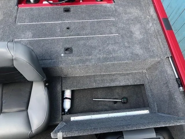 Slide: The Image of 2024 Tracker Pro 170 boat interior with storage compartment and seating. - 16