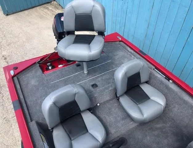 Slide: The Image of 2024 Tracker Pro 170 boat interior with three gray seats. - 17