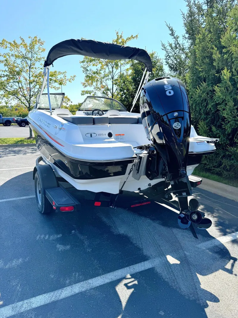 Slide: The Image of 2024 Tahoe 185 S boat with outboard motor in parking lot. - 5