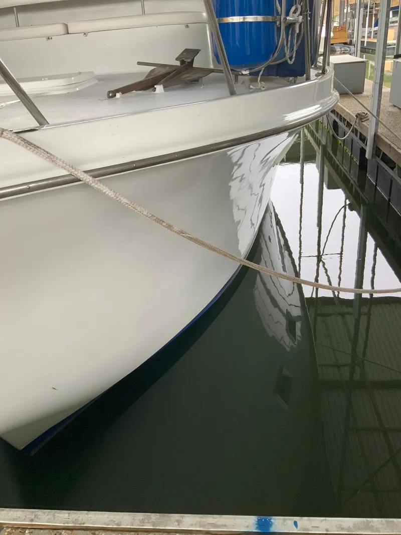 Slide: The Image of 1969 Hatteras 41 Double Cabin boat docked in marina. - 10