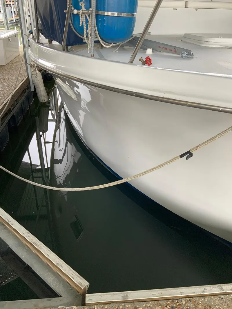 Slide: The Image of 1969 Hatteras 41 Double Cabin yacht docked in marina. - 11