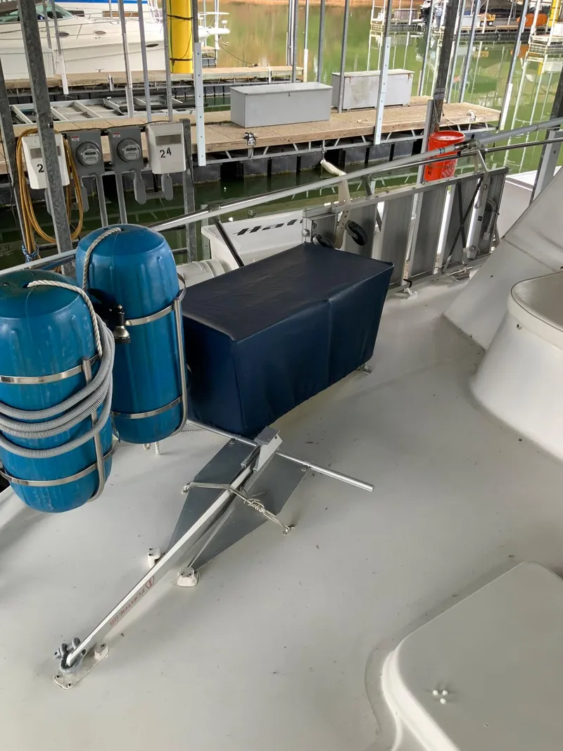 Slide: The Image of 1969 Hatteras 41 Double Cabin deck with blue storage and safety equipment. - 14