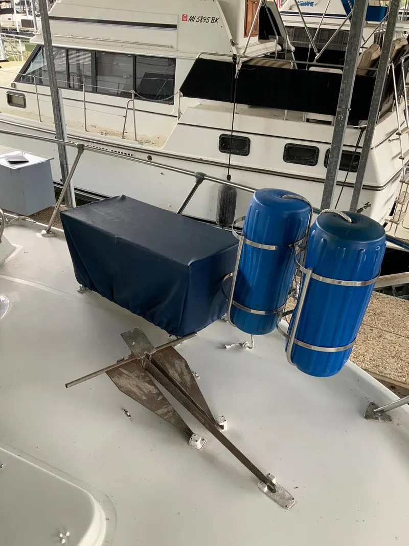 Slide: The Image of 1969 Hatteras 41 Double Cabin deck with anchor and blue water tanks. - 15