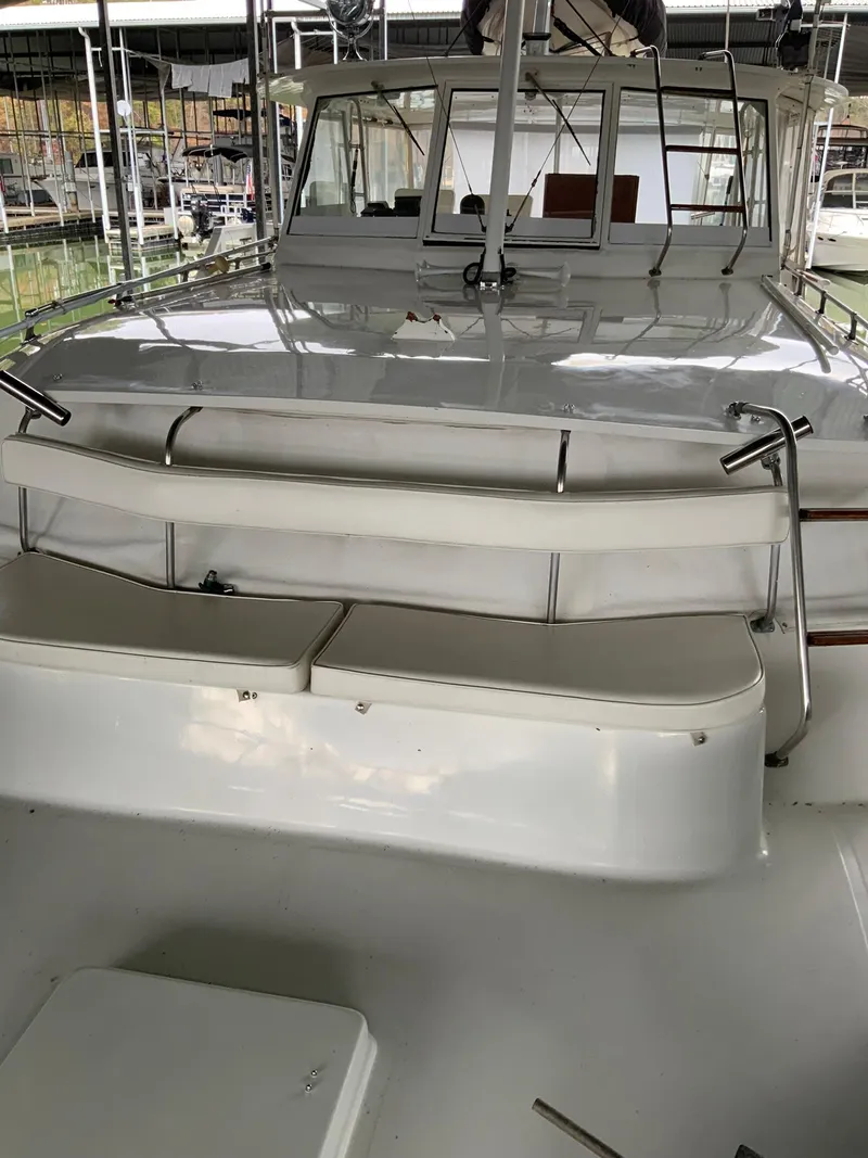 Slide: The Image of 1969 Hatteras 41 Double Cabin yacht with spacious deck and seating area. - 17