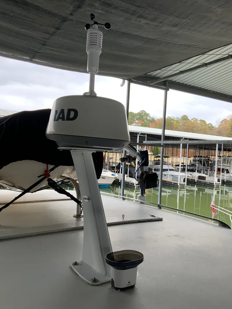 Slide: The Image of Radar equipment on a 1969 Hatteras 41 Double Cabin yacht under a marina roof. - 19