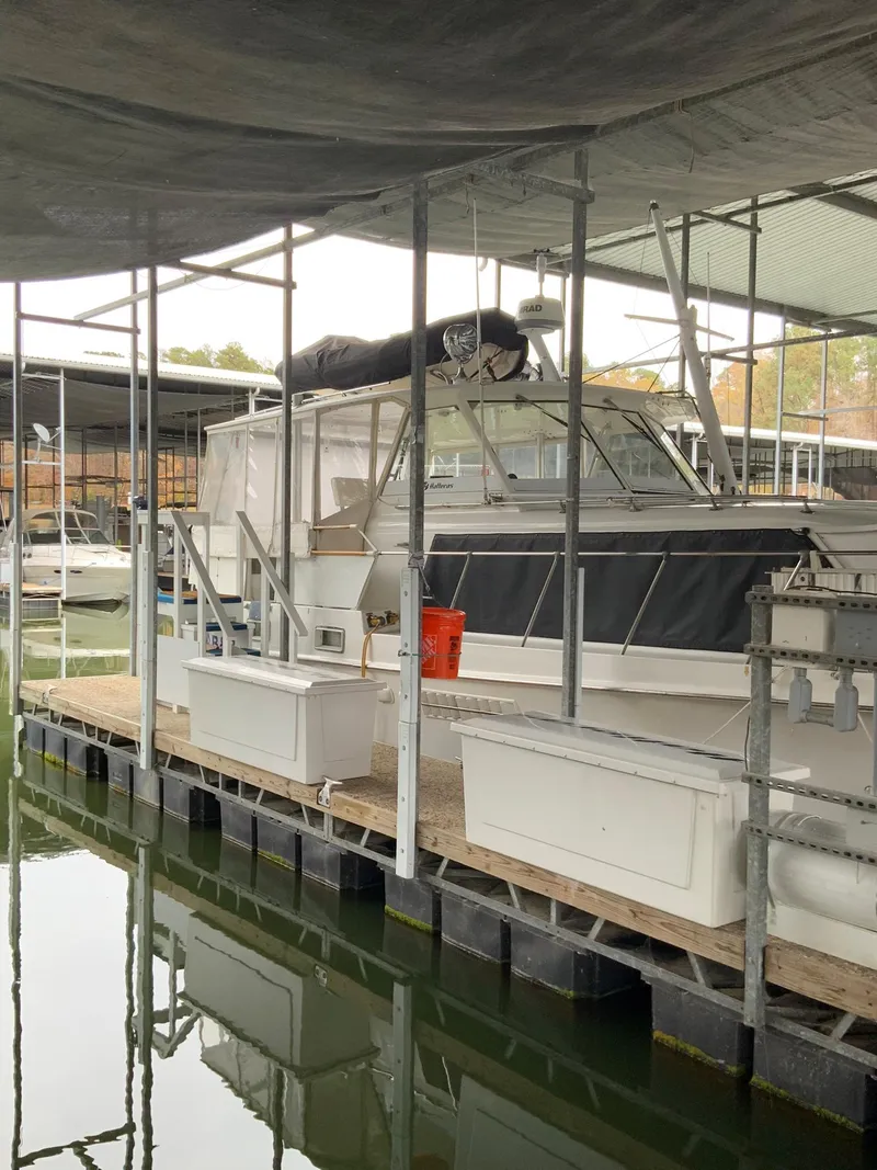 Slide: The Image of 1969 Hatteras 41 Double Cabin docked in a marina. - 2