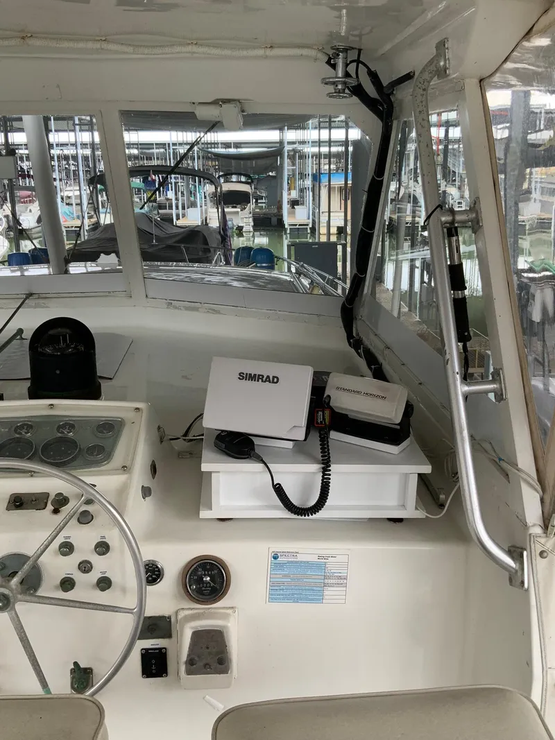 Slide: The Image of 1969 Hatteras 41 Double Cabin helm with Simrad navigation equipment. - 29