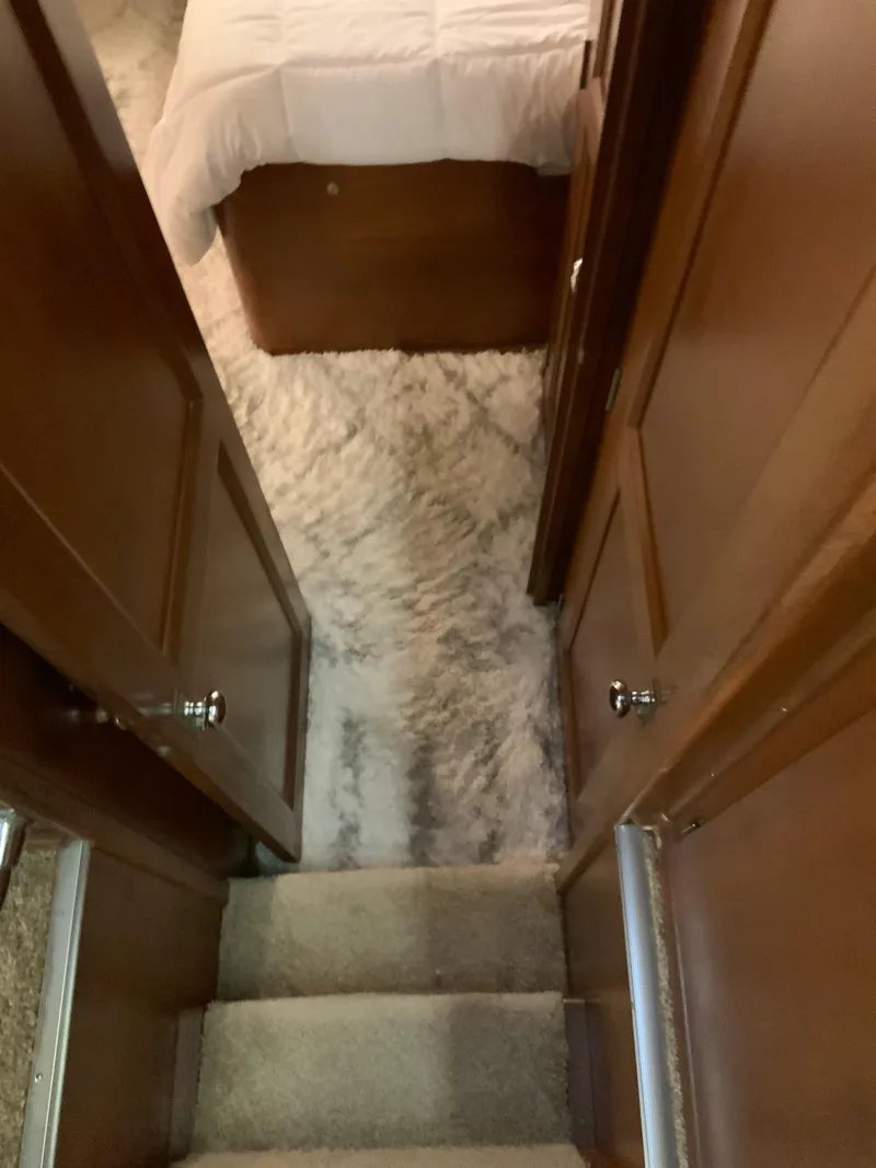 Slide: The Image of Interior of 1969 Hatteras 41 Double Cabin with carpeted stairs and wooden doors. - 46
