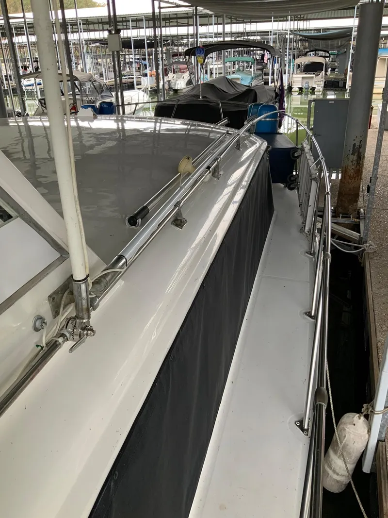 Slide: The Image of 1969 Hatteras 41 Double Cabin yacht docked at a marina. - 7