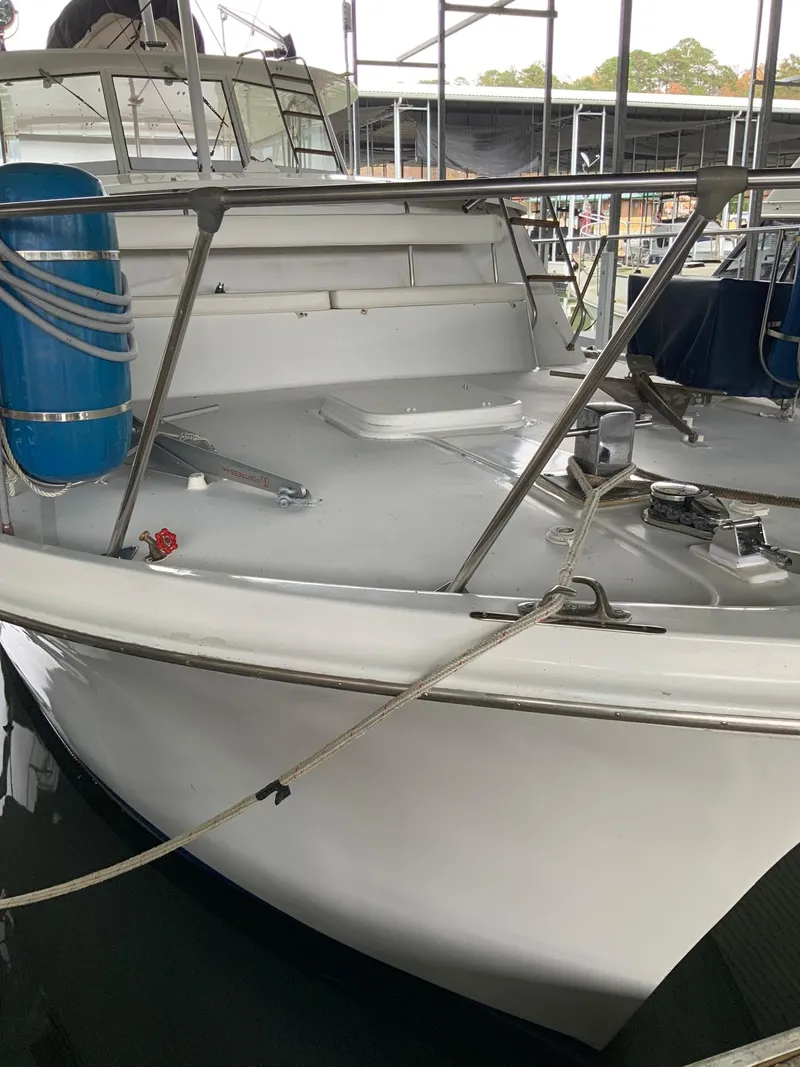 Slide: The Image of 1969 Hatteras 41 Double Cabin boat docked in a marina. - 9