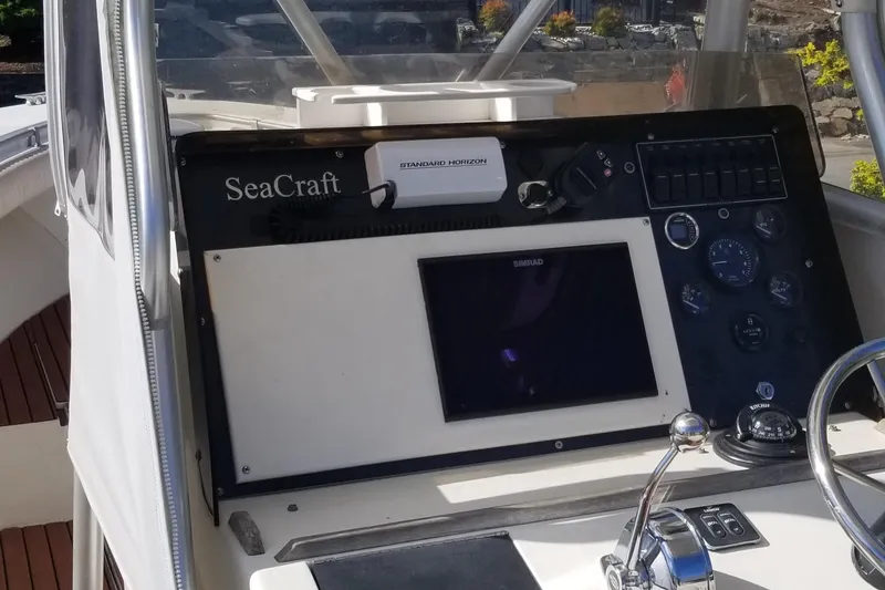 Slide: The Image of 1976 SeaCraft 23 Classic boat dashboard with navigation equipment. - 7