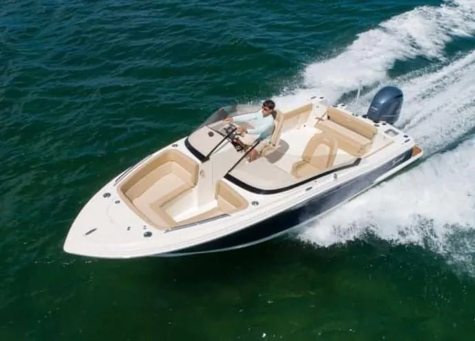 Slide: The Image of 2025 Scout 215 Dorado boat cruising on open water. - 3