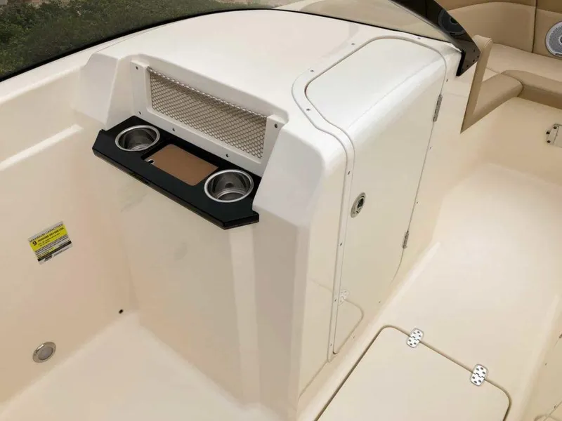 Slide: The Image of 2025 Scout 215 Dorado boat interior with cup holders and storage compartment. - 5