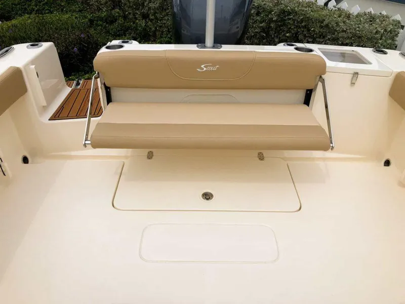 Slide: The Image of 2025 Scout 215 Dorado boat with beige seating and spacious deck. - 7