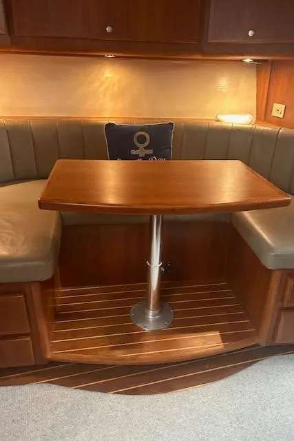 Slide: The Image of Luxurious wooden dining area inside a 2006 Topaz 40 Express yacht. - 10