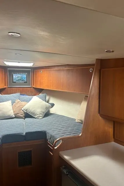 Slide: The Image of 2006 Topaz 40 Express cabin interior with bed and wooden cabinetry. - 12
