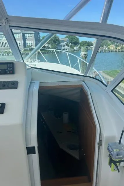 Slide: The Image of 2006 Topaz 40 Express boat interior with view of the cabin and waterfront. - 18