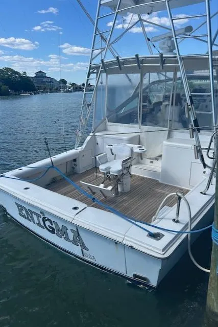 Slide: The Image of 2006 Topaz 40 Express boat docked at marina. - 21