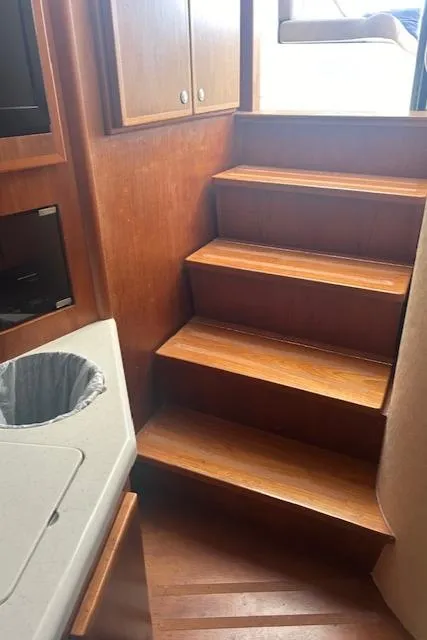Slide: The Image of Interior stairs of a 2006 Topaz 40 Express boat. - 6