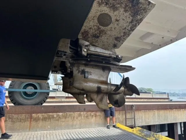 Slide: The Image of Propeller and stern drive of 2014 Regal 35 Sport Coupe boat on dock. - 14