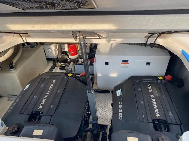 Slide: The Image of 2014 Regal 35 Sport Coupe engine compartment with Volvo Penta engines and equipment. - 16