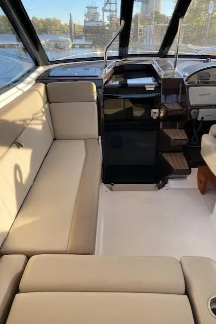 Slide: The Image of Interior of 2014 Regal 35 Sport Coupe with beige seating and modern helm. - 4