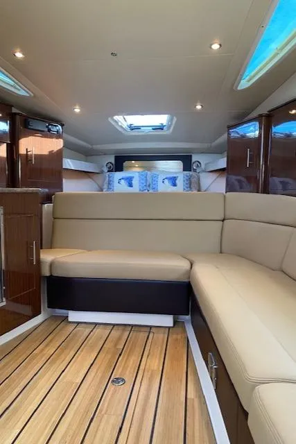 Slide: The Image of Luxurious interior of 2014 Regal 35 Sport Coupe with new engines, featuring plush seating. - 7