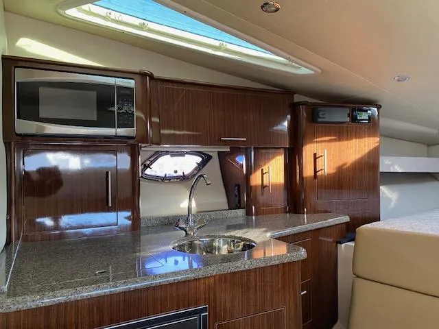 Slide: The Image of Luxurious interior of 2014 Regal 35 Sport Coupe with modern kitchenette. - 9