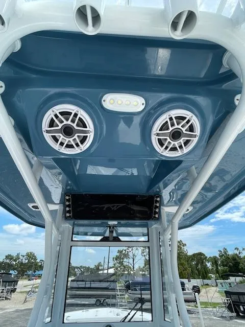 Slide: The Image of 2025 Tidewater 256 LXF boat interior with speakers and LED lights. - 11