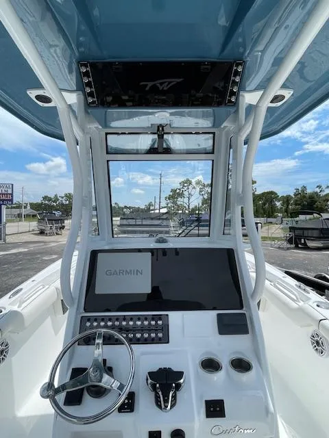 Slide: The Image of 2025 Tidewater 256 LXF boat dashboard with Garmin navigation system. - 12