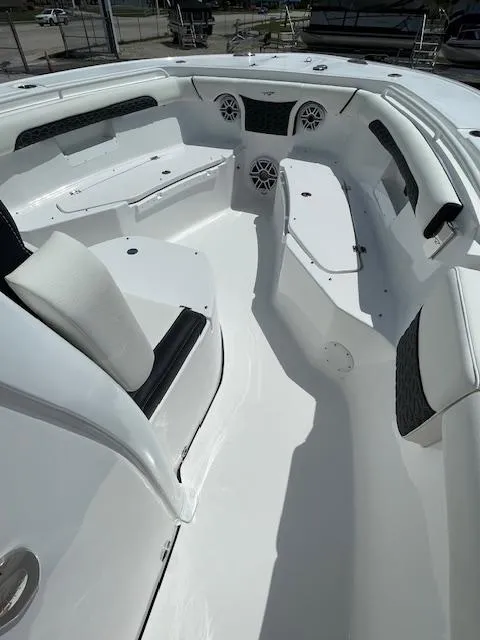 Slide: The Image of 2025 Tidewater 256 LXF boat interior with white seating and modern design. - 14