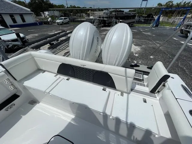 Slide: The Image of 2025 Tidewater 256 LXF boat with dual engines and spacious seating area. - 20