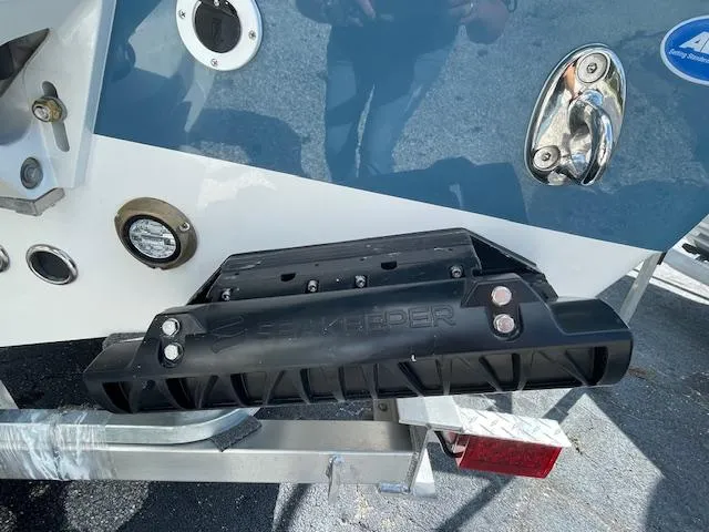 Slide: The Image of 2025 Tidewater 256 LXF boat with Seakeeper stabilizer on trailer. - 21