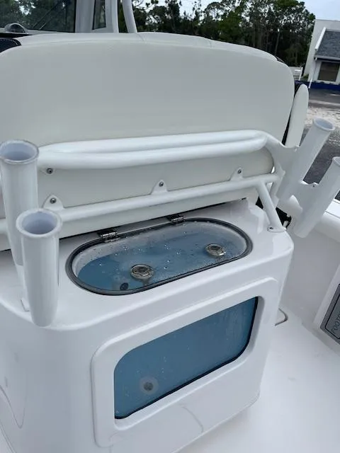 Slide: The Image of 2025 Tidewater 256 LXF boat with rod holders and livewell on deck. - 24