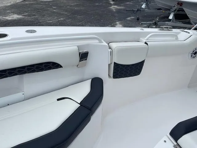 Slide: The Image of 2025 Tidewater 256 LXF boat interior with white and black seating, modern design. - 28