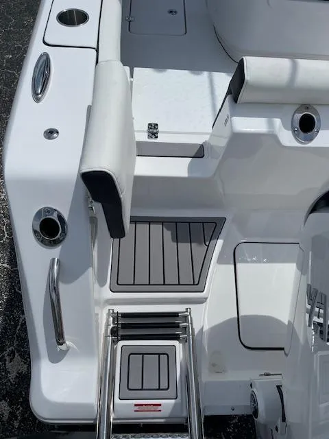 Slide: The Image of 2025 Tidewater 256 LXF boat deck with ladder and seating area. - 7