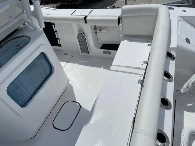Slide: The Image of 2025 Tidewater 256 LXF boat interior with seating and storage compartments. - 8