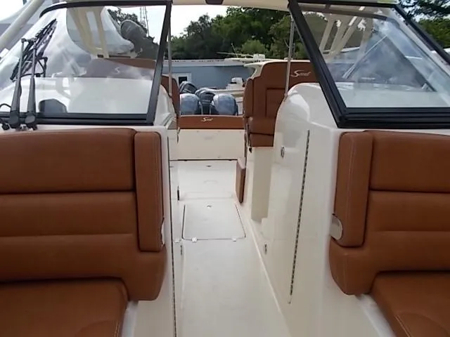 Slide: The Image of 2025 Scout 255 Dorado boat interior with brown leather seats. - 11